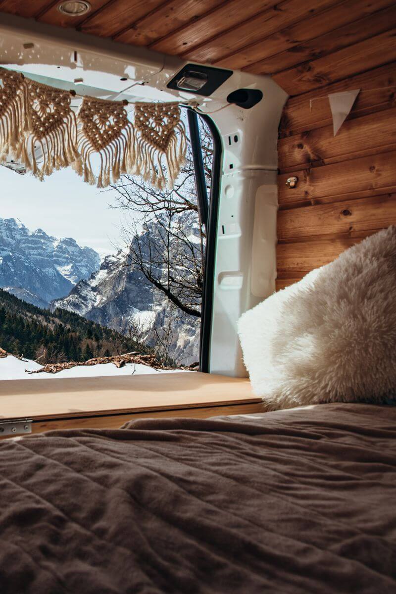 Vanlife frame bed system with premium custom mattress, designed for comfort and durability on road trips in vans, skoolies, and RVs.