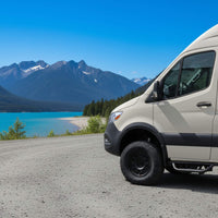 Passenger side running board installed on a Sprinter, making entry and exit comfortable and secure.
