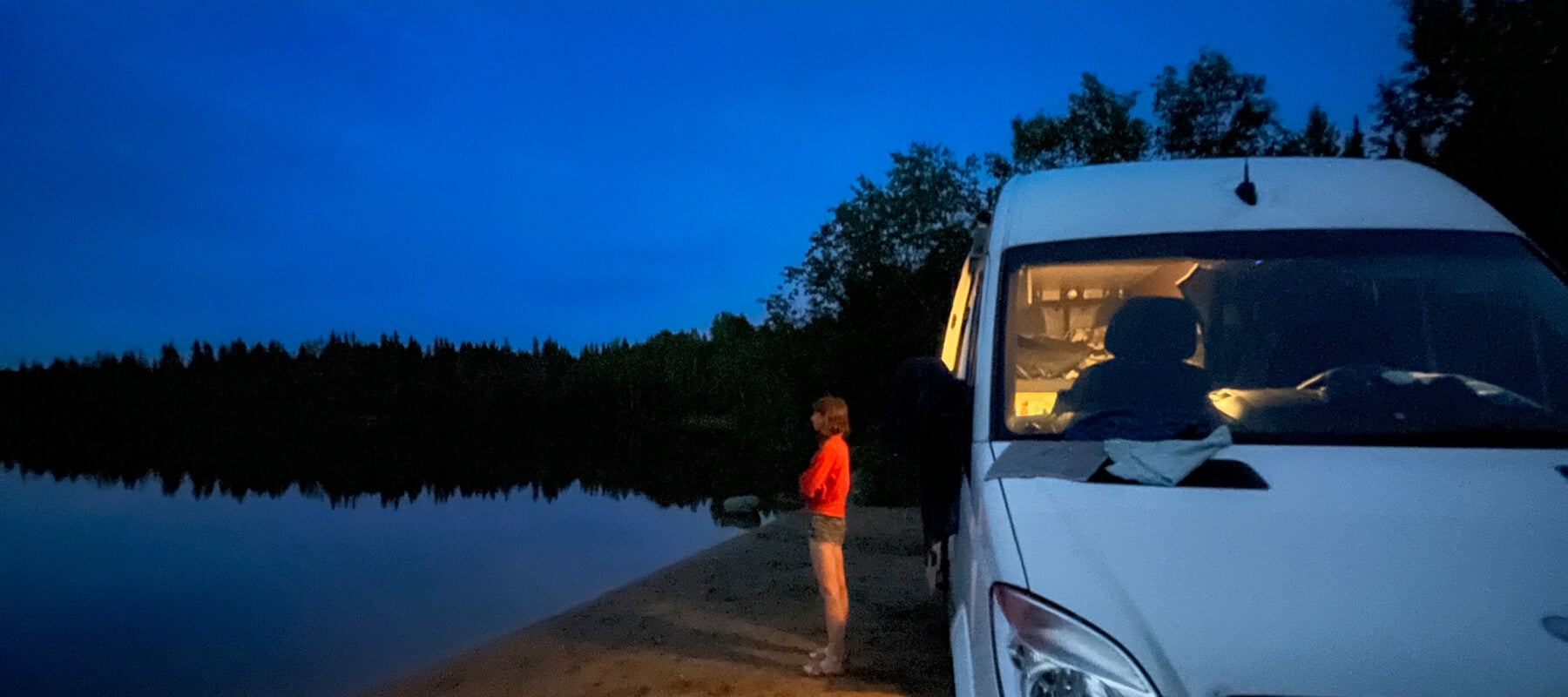 Blue Skie Van parked right on the beach by the river Boondocking spot in Quebec
