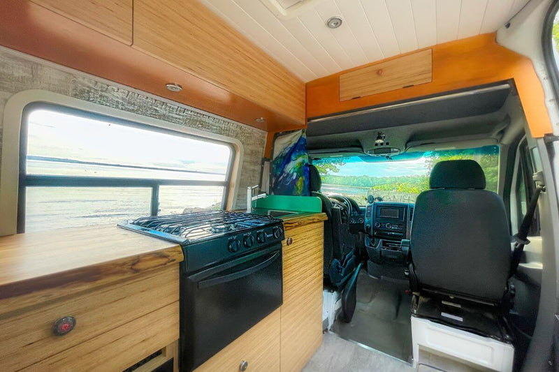 Lonavity custom van conversion, van rental. We use Birch Wood for all our van conversions from the shelves, to the kitchen frame, to the garage and the bed. Birch Wood is sustainable and has little impact on our global environment
