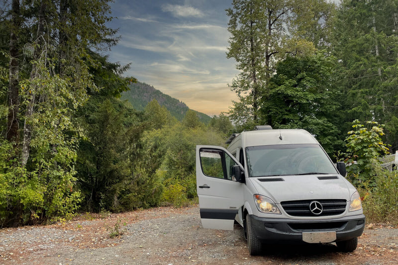 Lonavity van conversion travelling to BC parked by the mountains beautiful sunset, you can camp anywhere with the van
