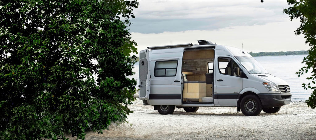 Lonavity van parked by the Gatineau River, custom van conversion and rental
