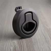 Black dual-spring slam latch for van cabinets, keeps drawers and doors securely closed during travel.