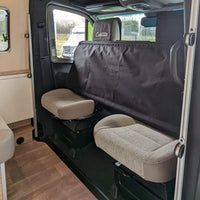 Overhead view of the twin bunk bed system fully set up in a camper van. / Vue en plongée du système de lits superposés entièrement installé dans un van aménagé.