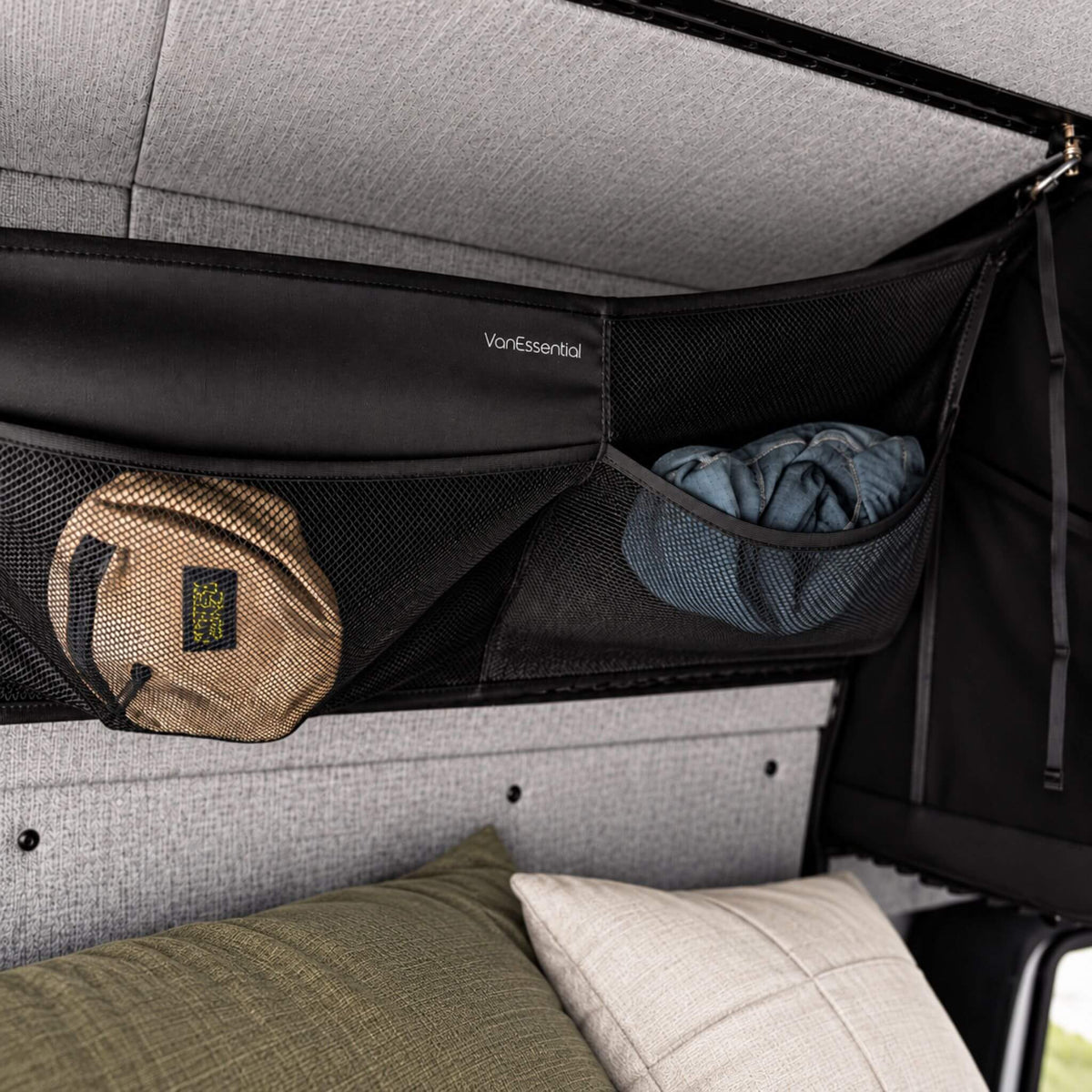 Medium double-sided cargo net with six pockets for keeping clothing, accessories and camping gear organized.