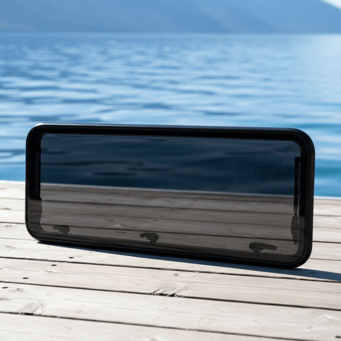 Compact flush-mount flat window with a modern design for van builds.