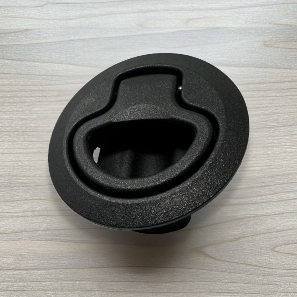 Black dual-spring cabinet latch for vans, durable and reliable for secure storage on the road.