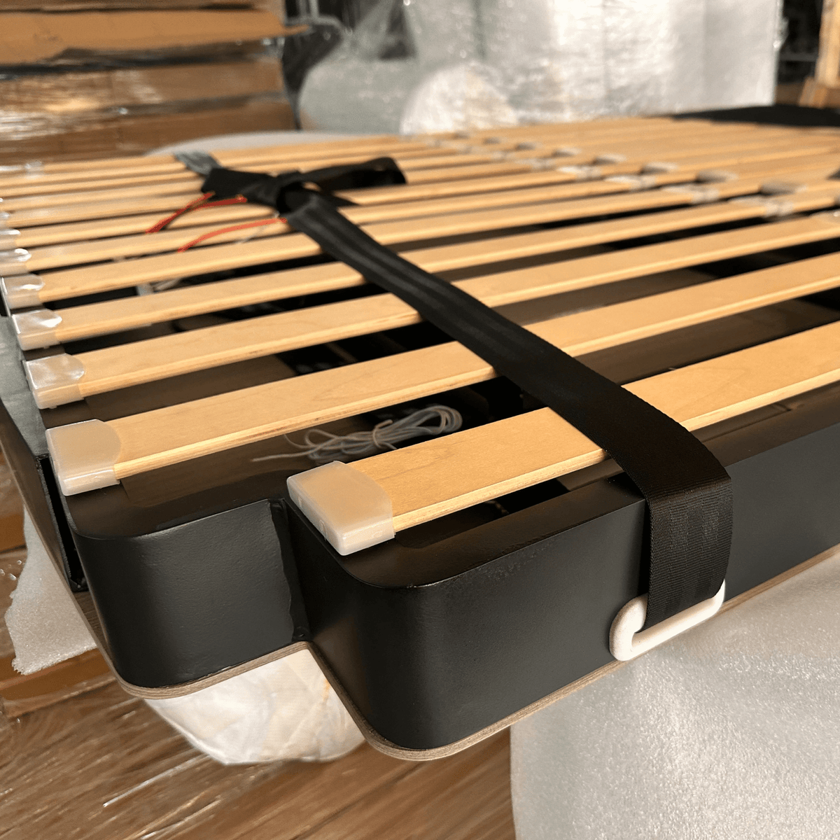 Electric bed lift adding living space to a campervan or recreational vehicle