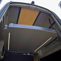 Expandable sliding bed that widens the sleeping area in a campervan conversion
