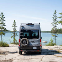 Ford Transit rear door ladder and spare tire carrier installed on camper van