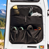 Pair of Ford Transit rear door storage panels with durable black pockets for practical van conversion organization.