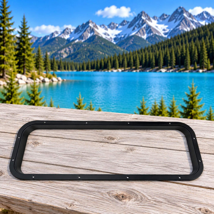Slim black interior window trim ring for van conversions.