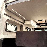 L-Track flanged rail in anodized matte black aluminum for securing cargo in van conversions