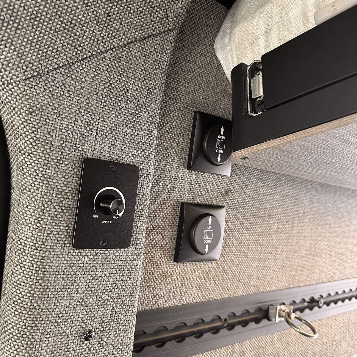 Lift and slide bed system freeing up garage space for vanlife gear