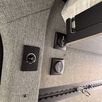Lift and slide bed system freeing up garage space for vanlife gear