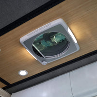Solar-compatible roof fan installed in skoolie conversion for off-grid use / Ventilateur de toit compatible solaire installé dans une conversion skoolie pour usage autonome.