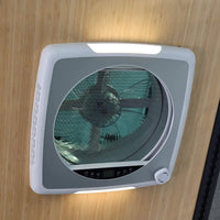 Transparent gray roof fan cover on bus providing a view of the sky / Couvercle gris transparent sur ventilateur de toit bus offrant une vue sur le ciel.