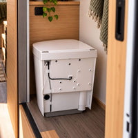Separett Tiny waterless toilet showing the internal waste separation mechanism for off-grid sanitation.