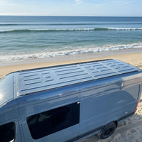 Top view of heavy-duty roof rails installed on Sprinter & Dodge van for overlanding adventures | Vue de dessus des rails de toit robustes Sprinter et Dodge pour aventures overlanding et vanlife