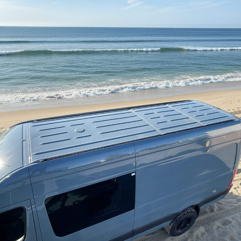 Top view of heavy-duty roof rails installed on Sprinter & Dodge van for overlanding adventures | Vue de dessus des rails de toit robustes Sprinter et Dodge pour aventures overlanding et vanlife