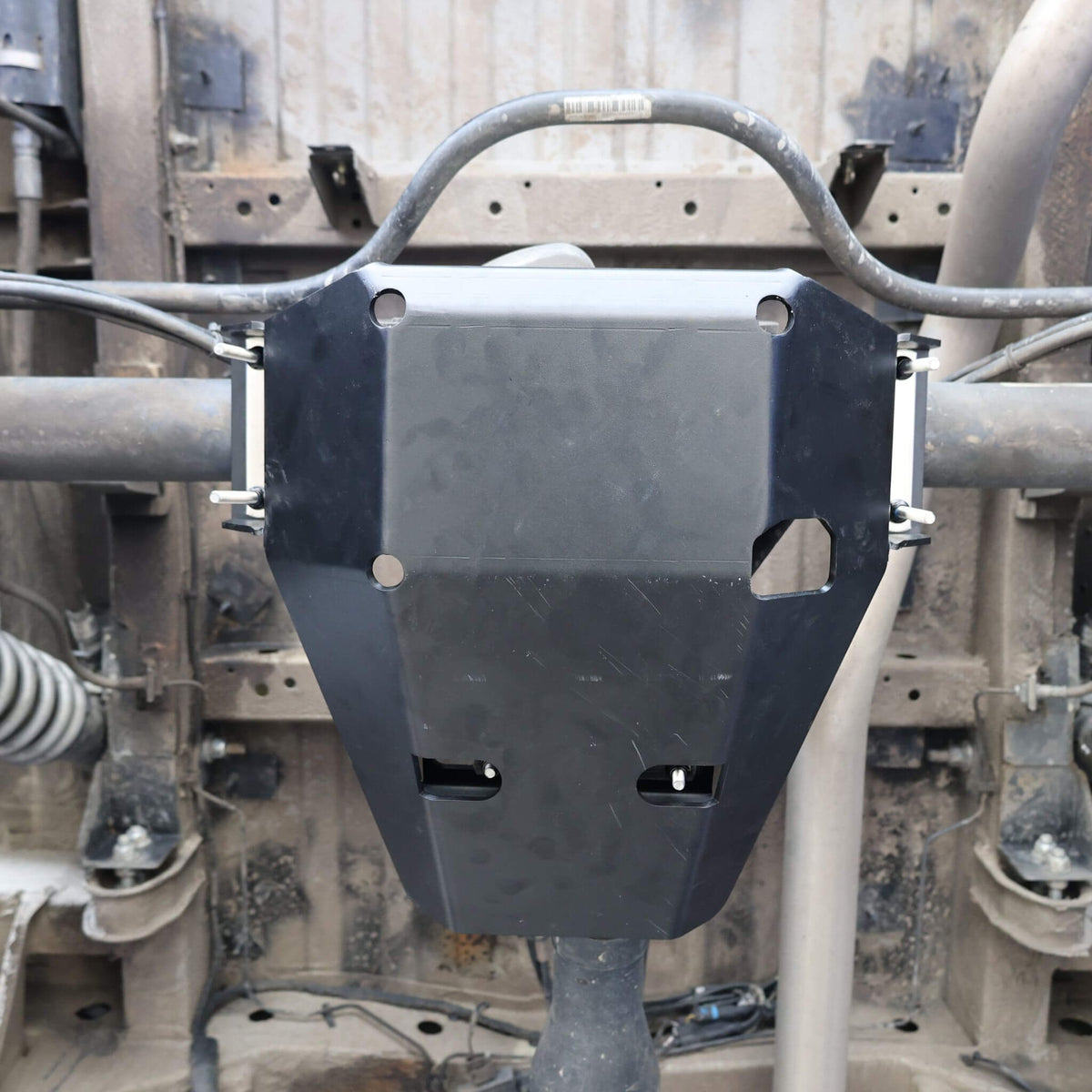 Rear axle differential guard for Sprinter 2500 (2007+) showing steel construction and secure U-bolt mounting system.