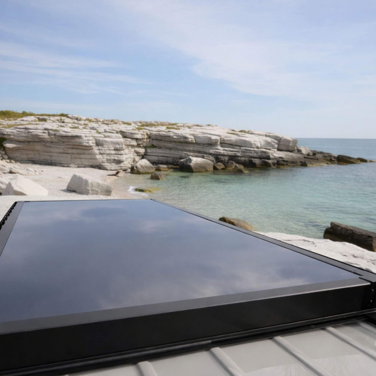 Lightweight carbon fiber rooftop tent installed on a Sprinter van for extended van life use