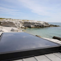 Lightweight carbon fiber rooftop tent installed on a Sprinter van for extended van life use