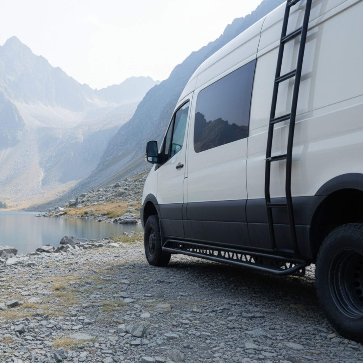 Sprinter aluminum running boards with drop-down step parked in a quiet natural setting