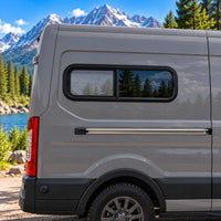 Overlander OVR3511 universal half-slider bunk window with black aluminum frame, solar privacy glass and fixed bug screen.