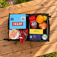 VanEssential 18 L collapsible storage box keeping snacks and food organized for vanlife trips.
