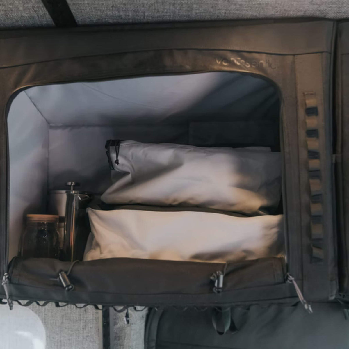 VanEssential 18 L packing cube with carry handles for easy storage in a motorhome or van.