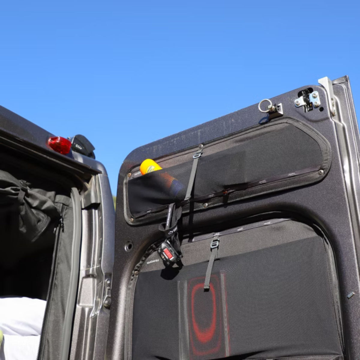 VanEssential upper rear door storage panels for Ram ProMaster van conversions.