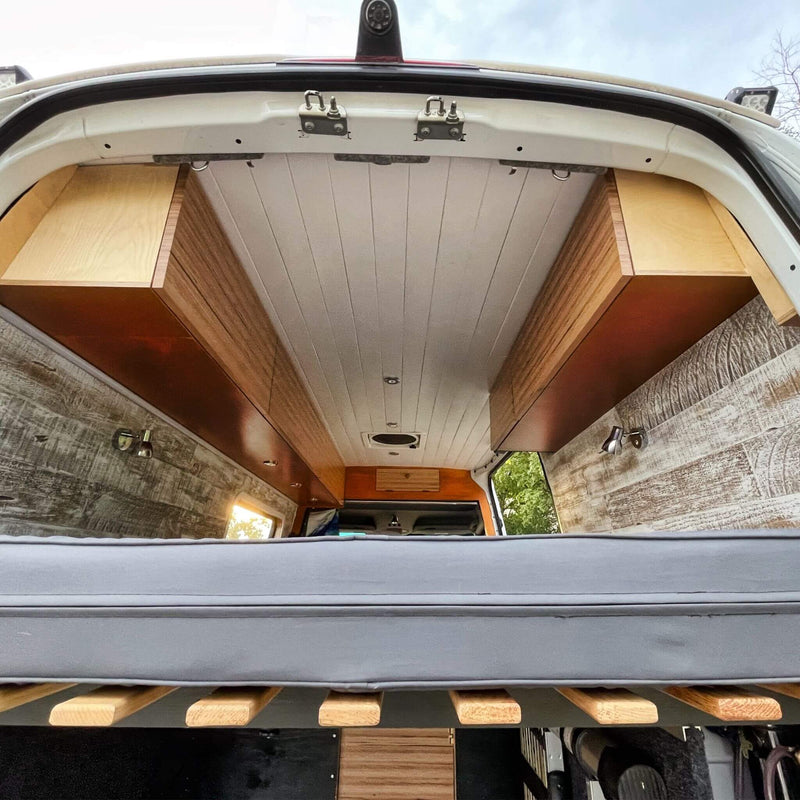Lonavity van custom van conversion, beautiful cabinets and fold-out bed